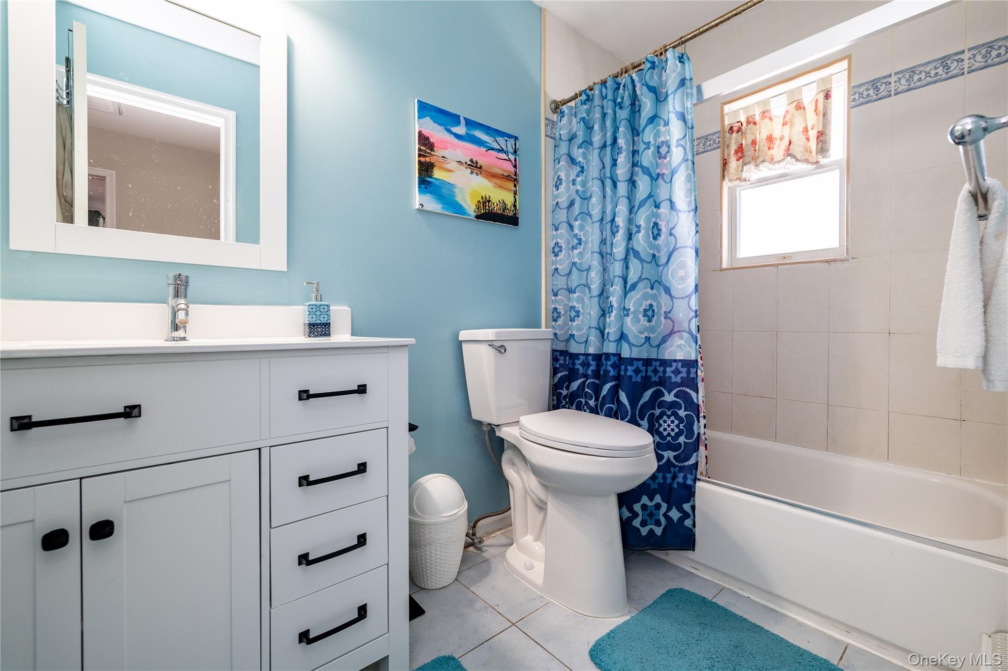 458 East Pine Street Long Beach, NY 11561 - Photo 16 of 26 a bathroom with a toilet a sink and a bathtub