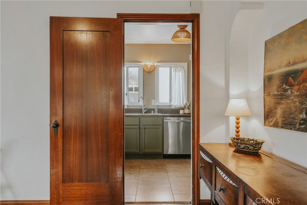 1502 East 57th Street Long Beach, CA 90805 - Photo 15 of 31 a kitchen with a refrigerator and a stove