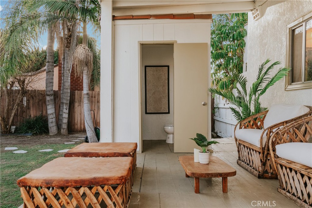 1502 East 57th Street Long Beach, CA 90805 - Photo 25 of 31 a backyard of a house with barbeque oven table and chairs
