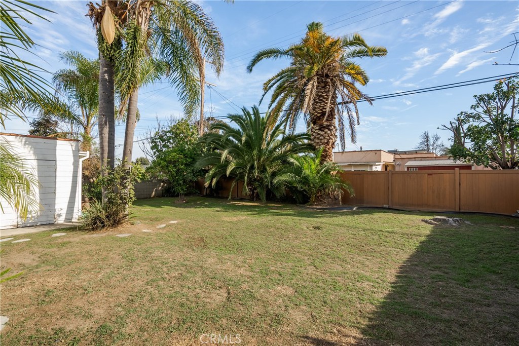 1502 East 57th Street Long Beach, CA 90805 - Photo 28 of 31 a view of a yard with palm trees