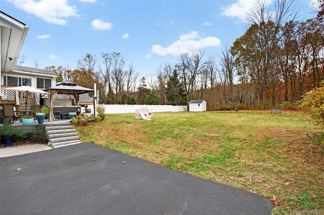 a view of a building with mountains in the background