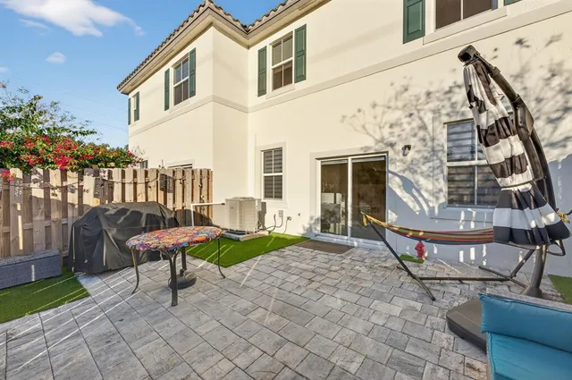 a view of a backyard with sitting area
