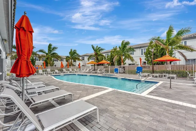 a view of a grassy field with an trees