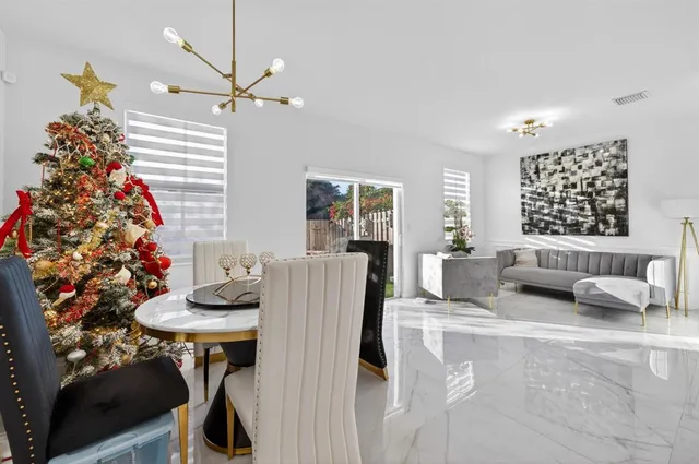 a kitchen with kitchen island a counter top space appliances and cabinets