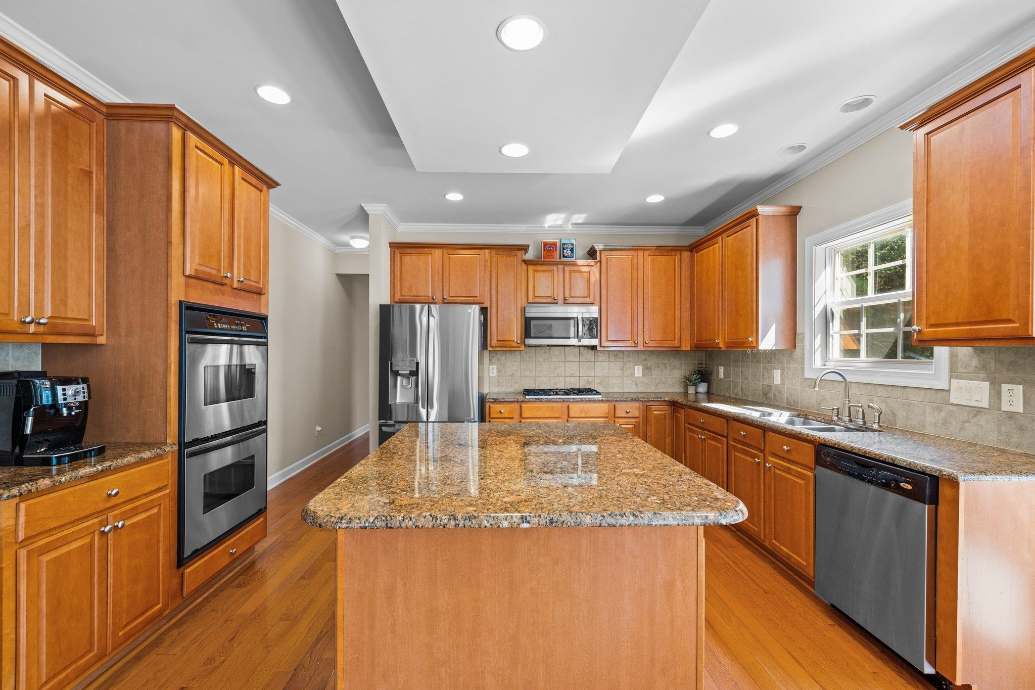 11900 Deneb Court Raleigh, NC 27614 - Photo 17 of 60 a kitchen with stainless steel appliances granite countertop a sink a stove and a refrigerator