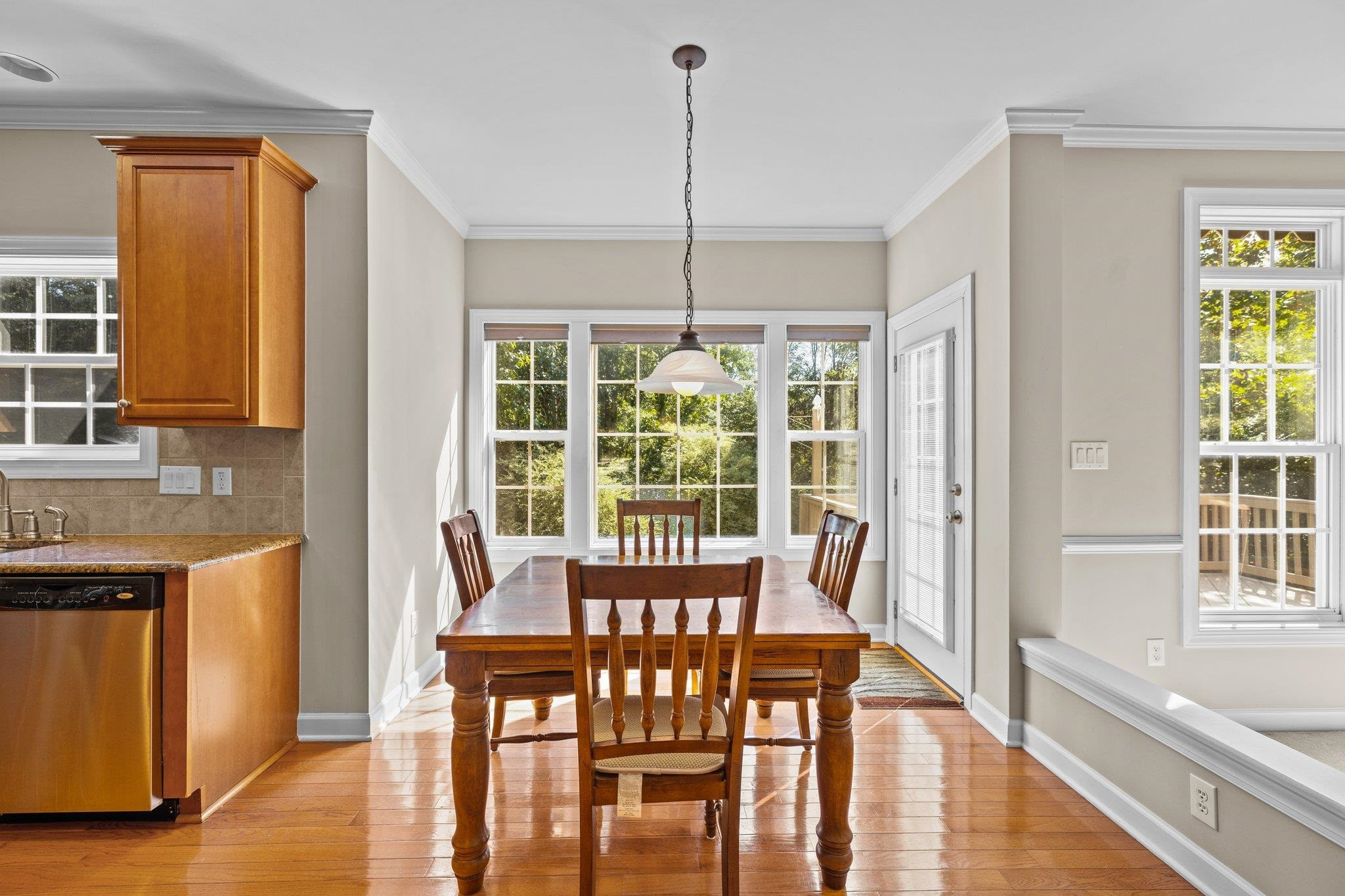 11900 Deneb Court Raleigh, NC 27614 - Photo 19 of 60 a view of a dining room with furniture window and wooden floor