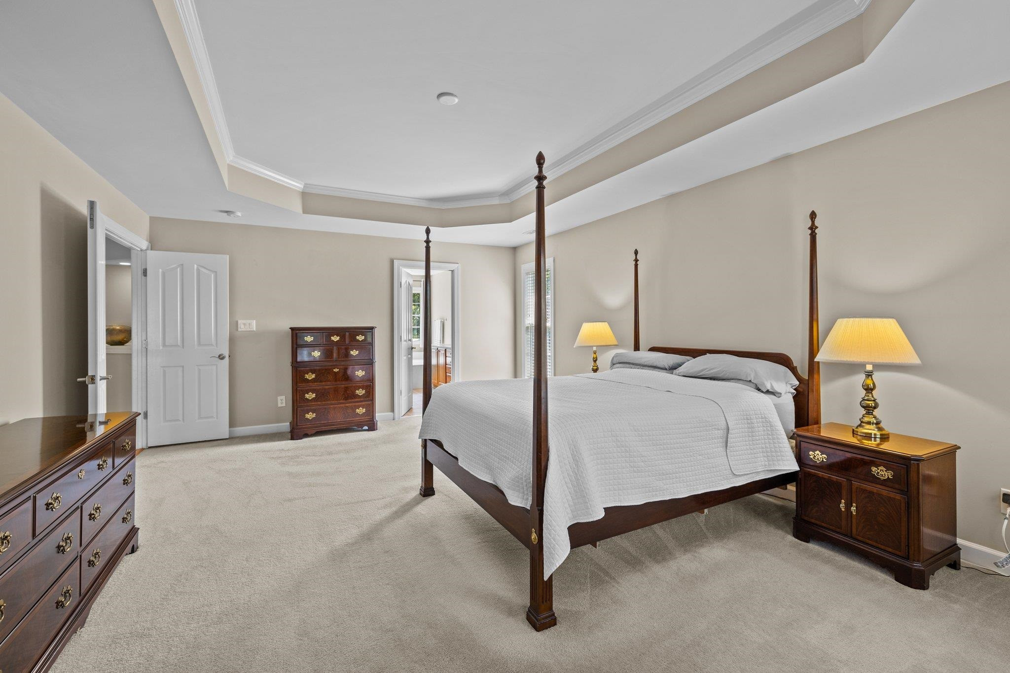 11900 Deneb Court Raleigh, NC 27614 - Photo 30 of 60 a bedroom with a bed closet and a flat tv screen