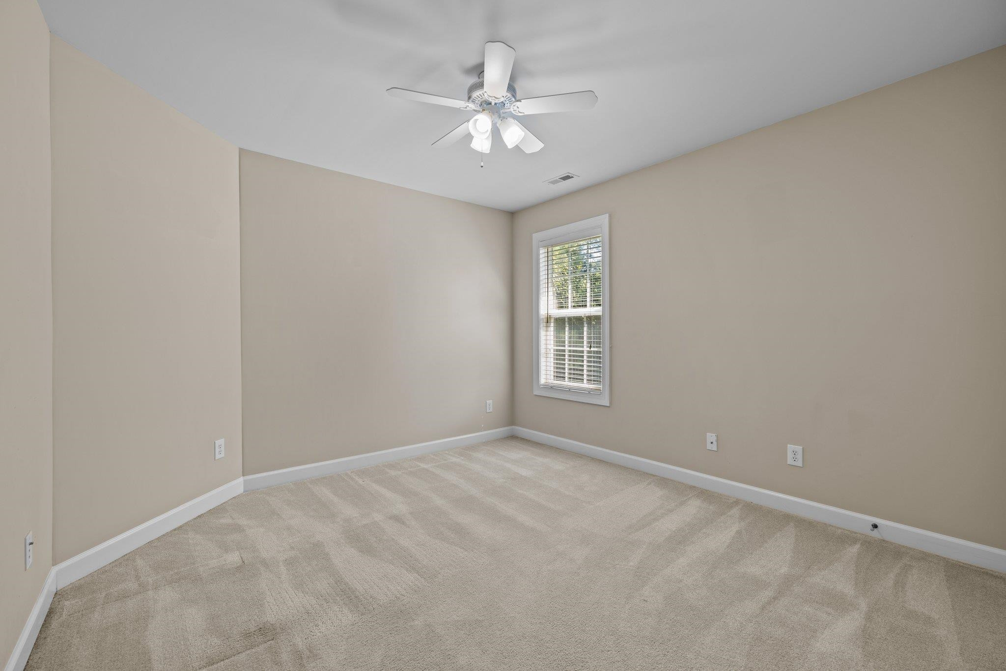11900 Deneb Court Raleigh, NC 27614 - Photo 37 of 60 a view of an empty room with a window
