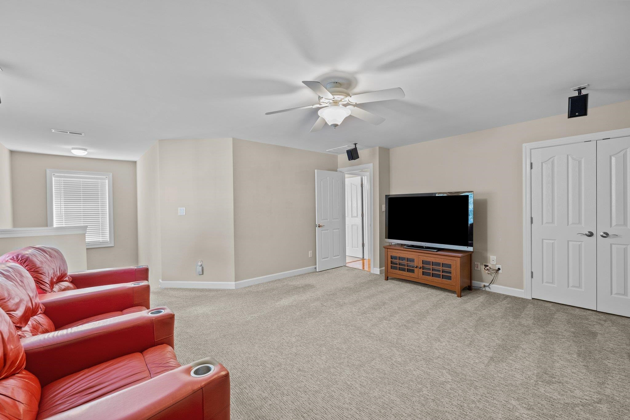 11900 Deneb Court Raleigh, NC 27614 - Photo 40 of 60 a living room with furniture and a flat screen tv