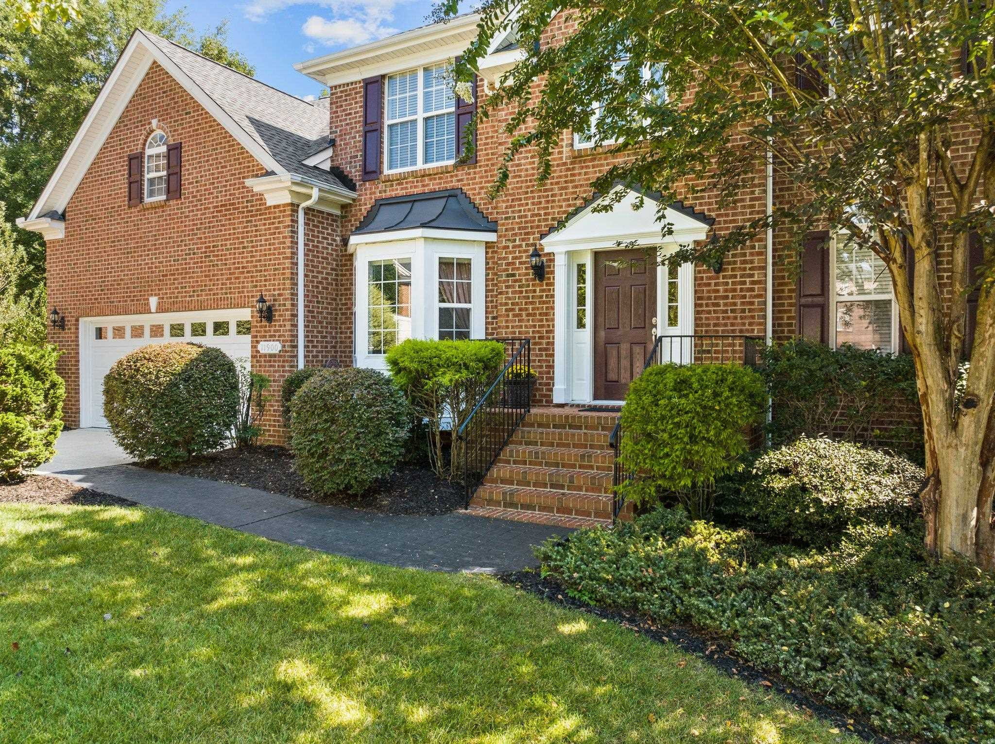 11900 Deneb Court Raleigh, NC 27614 - Photo 4 of 60 a front view of a house with a garden