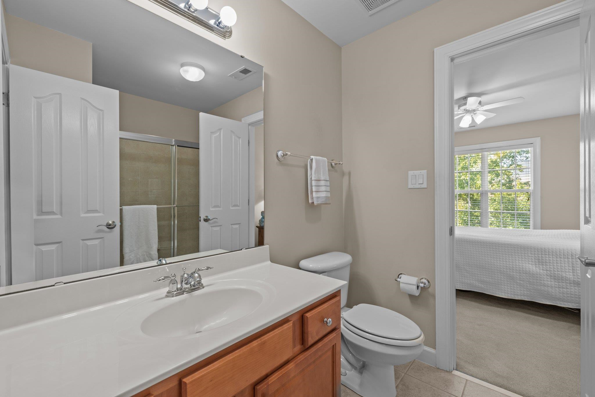 11900 Deneb Court Raleigh, NC 27614 - Photo 41 of 60 a bathroom with a granite countertop sink toilet and shower
