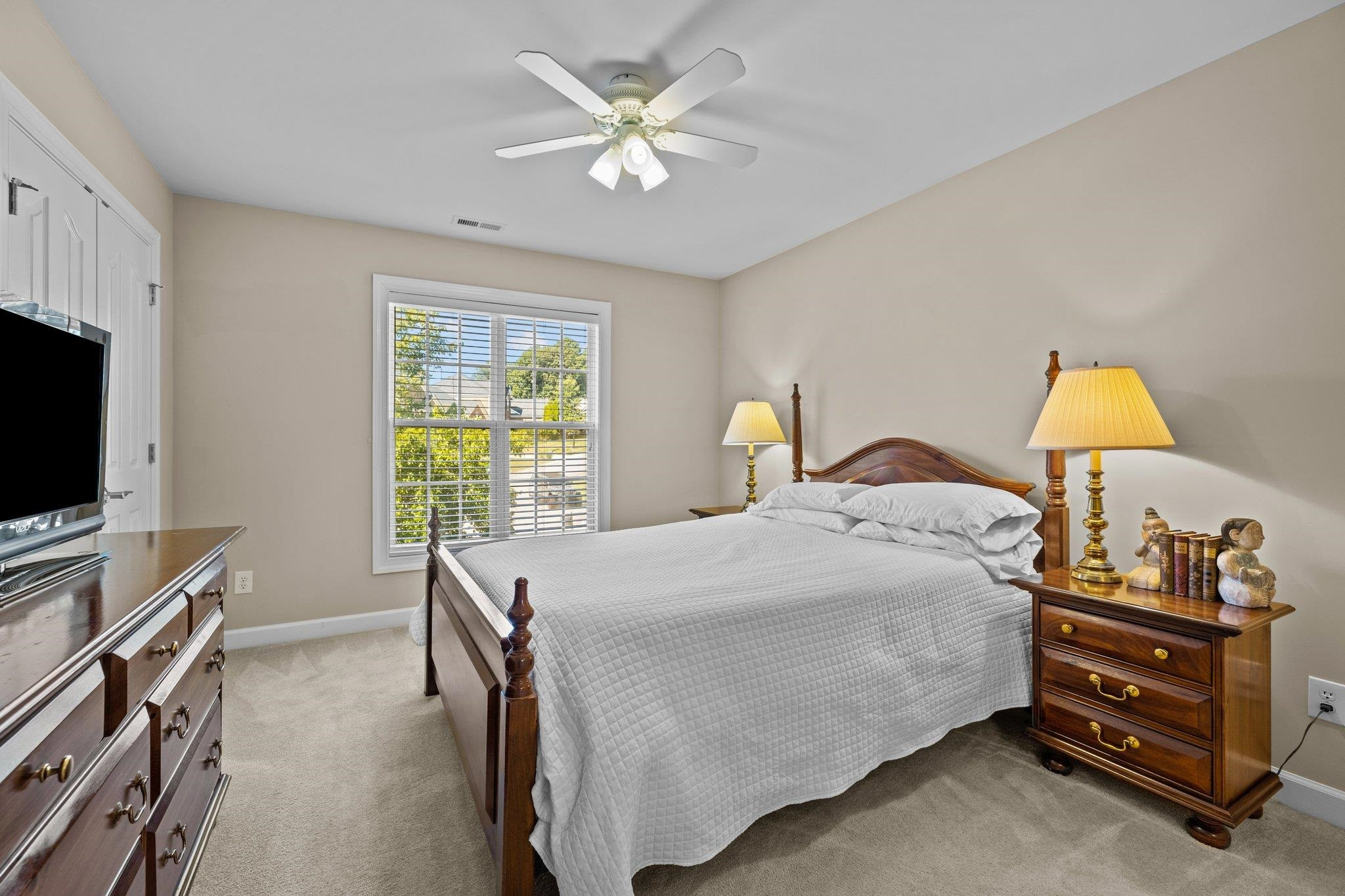 11900 Deneb Court Raleigh, NC 27614 - Photo 42 of 60 a bedroom with a bed and a flat screen tv