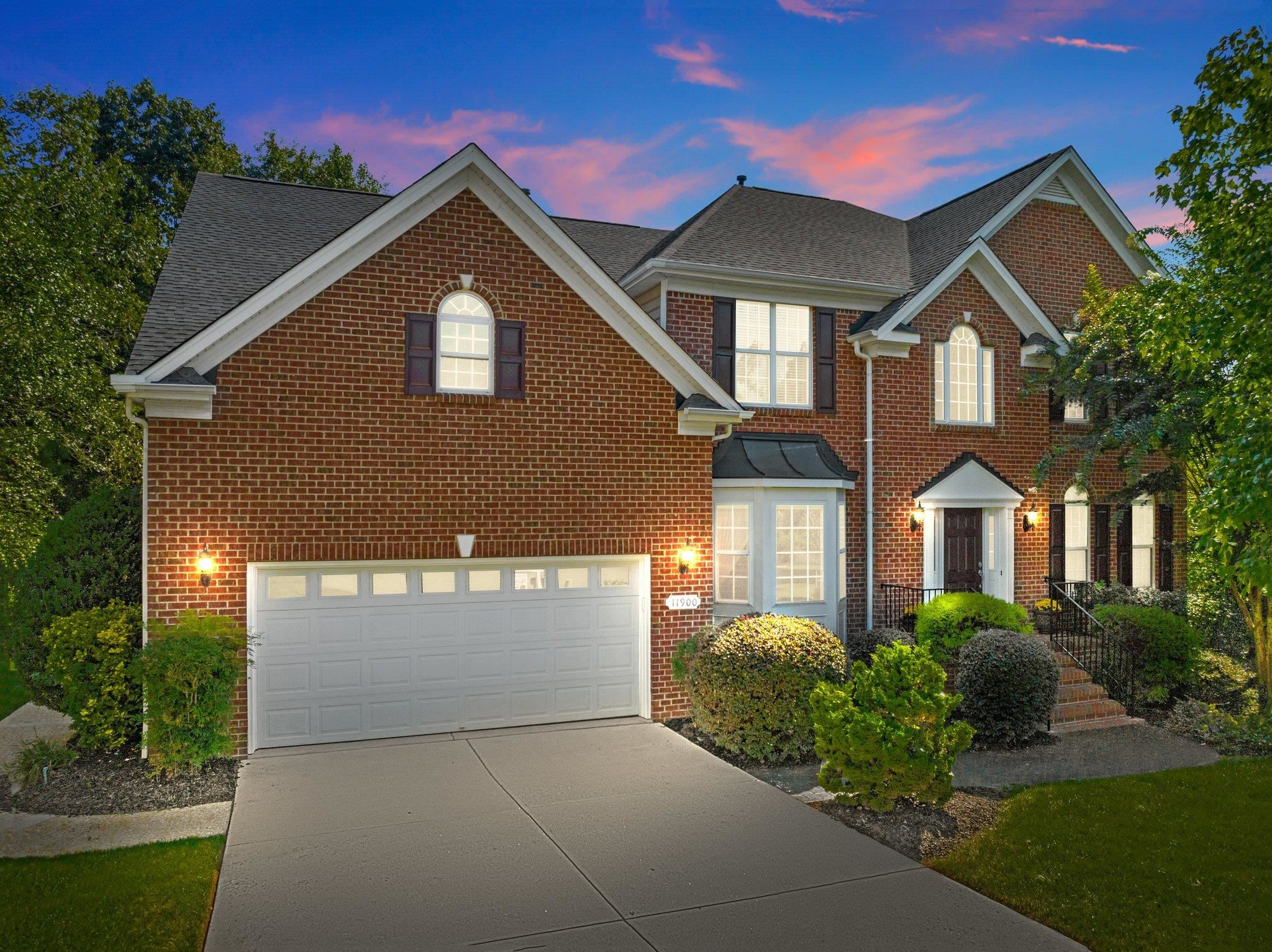 11900 Deneb Court Raleigh, NC 27614 - Photo 58 of 60 a front view of a house with a yard and garage