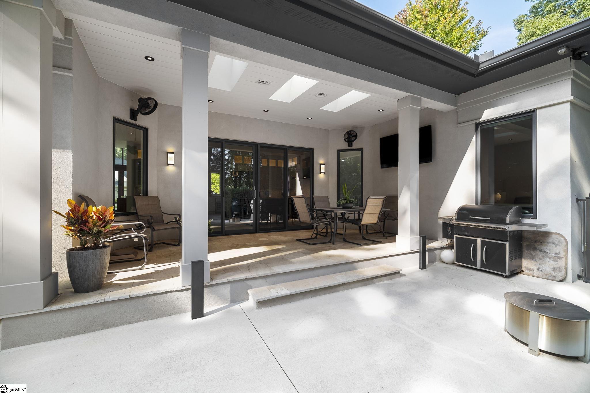 36 Gossamer Place Greenville, SC 29607 - Photo 46 of 50 Skylights, travertine marble flooring, sound system, outdoor TV. Roof fully insulated with speakers and TV.