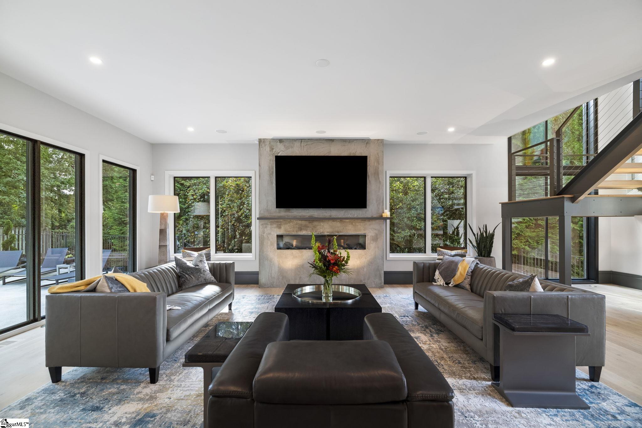 36 Gossamer Place Greenville, SC 29607 - Photo 5 of 50 Seventy-two inch natural gas linear fireplace with stainless background, gas logs, LED lighting, spark ignition with thermostat remote control.