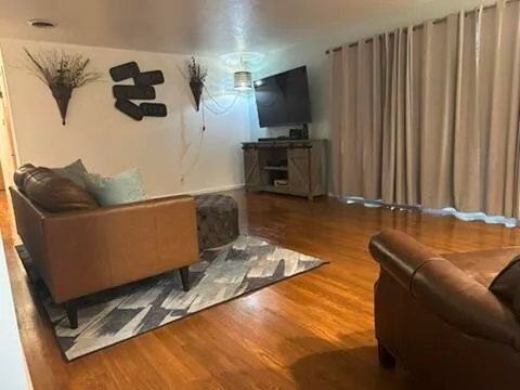 a living room with furniture and a flat screen tv