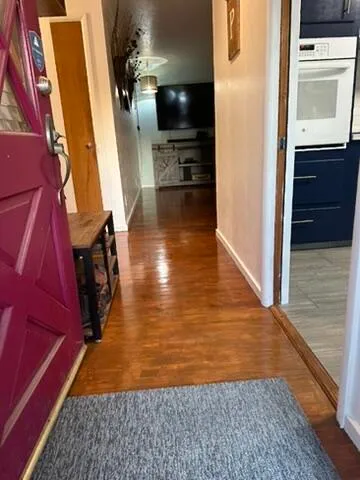 a view of a kitchen from the hallway