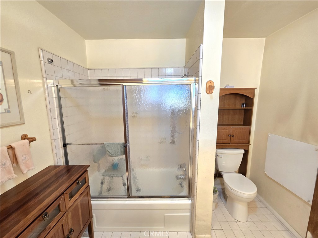 4280 County Road North Orland, CA 95963 - Photo 18 of 62 a bathroom with a granite countertop bathtub shower sink vanity and toilet