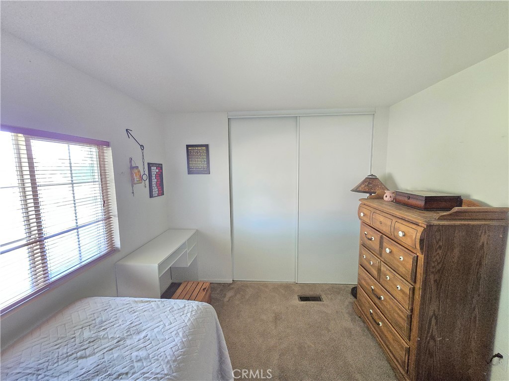 4280 County Road North Orland, CA 95963 - Photo 39 of 62 a bedroom with a bed and wooden floor