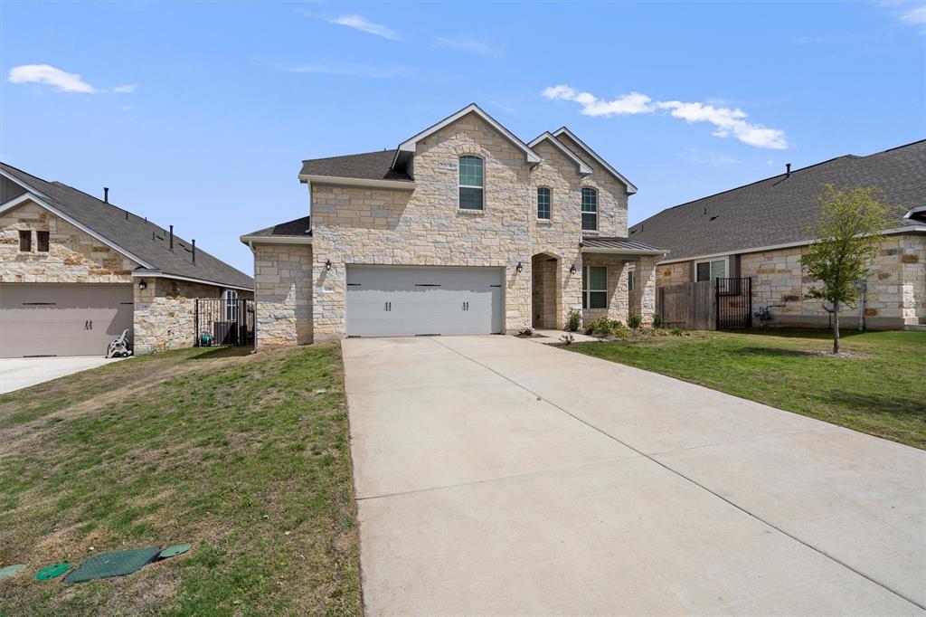 236 Prato Place Georgetown, TX 78628 - Photo 5 of 40 A striking stone facade enhances this property's welcoming curb appeal.