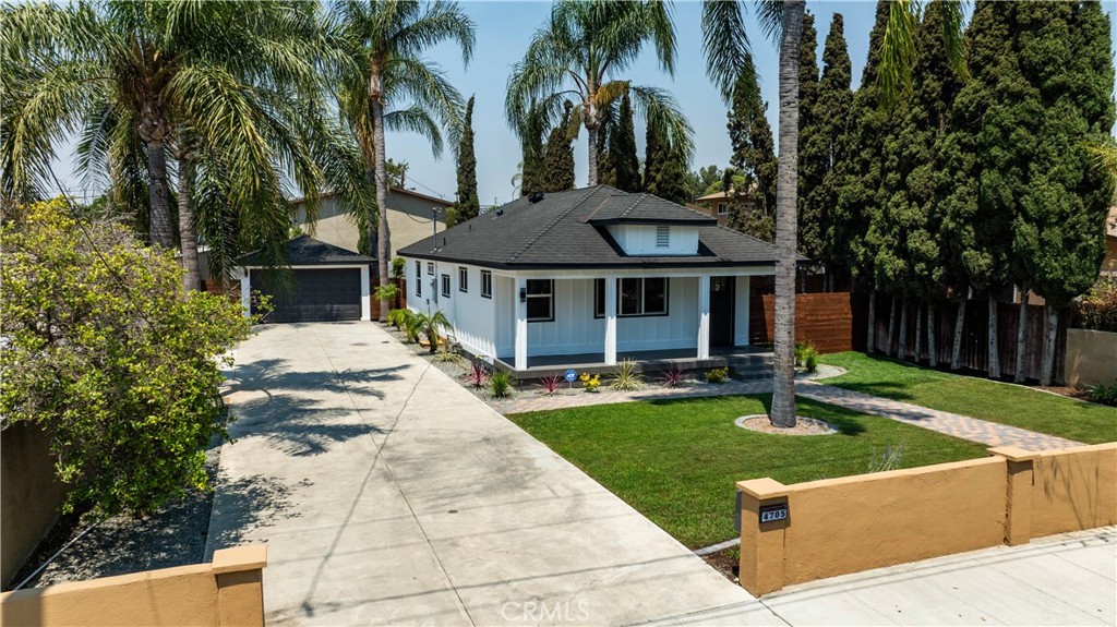 4705 East Washington Avenue Orange, CA 92869 - Photo 1 of 41 a front view of a house with garden