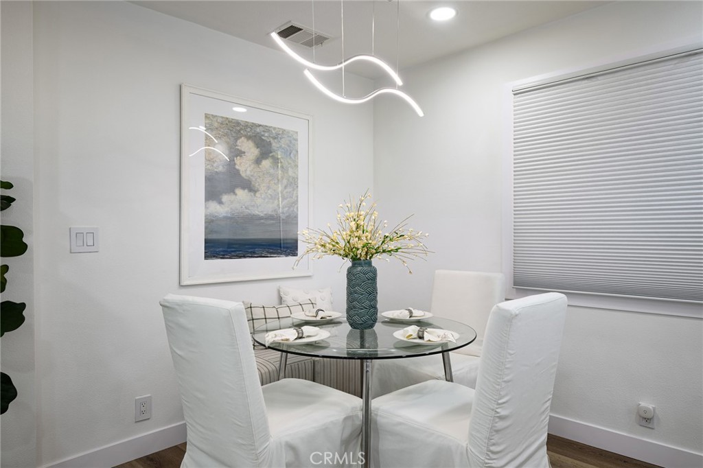 4705 East Washington Avenue Orange, CA 92869 - Photo 11 of 41 a dining room with furniture and wooden floor
