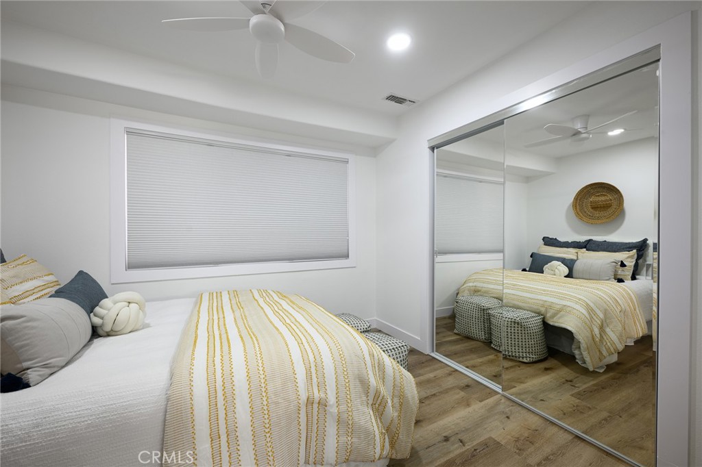 4705 East Washington Avenue Orange, CA 92869 - Photo 13 of 41 a bedroom with a bed and lamp