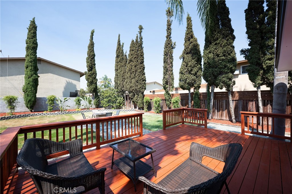 4705 East Washington Avenue Orange, CA 92869 - Photo 23 of 41 a view of a patio with iron fence