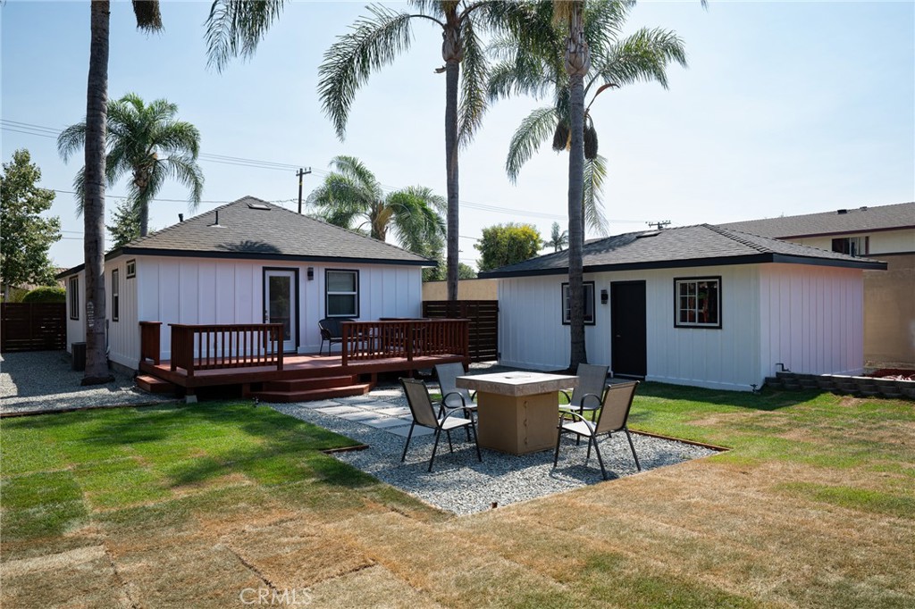 4705 East Washington Avenue Orange, CA 92869 - Photo 27 of 41 a view of a house with backyard sitting area and swimming pool