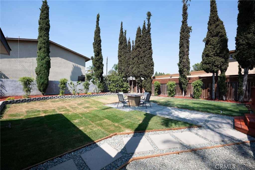 4705 East Washington Avenue Orange, CA 92869 - Photo 31 of 41 a view of a house with swimming pool and sitting area
