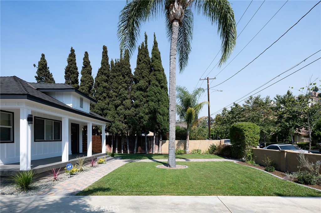 4705 East Washington Avenue Orange, CA 92869 - Photo 41 of 41 a front view of a house with garden