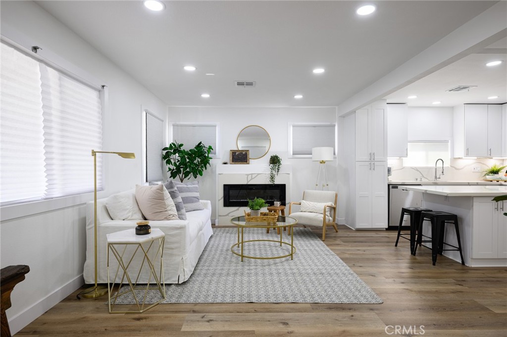 4705 East Washington Avenue Orange, CA 92869 - Photo 5 of 41 a living room with furniture and a fireplace