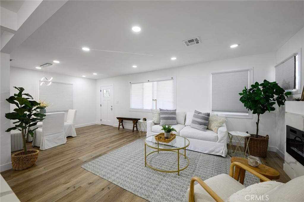 4705 East Washington Avenue Orange, CA 92869 - Photo 8 of 41 a living room with furniture and flowers