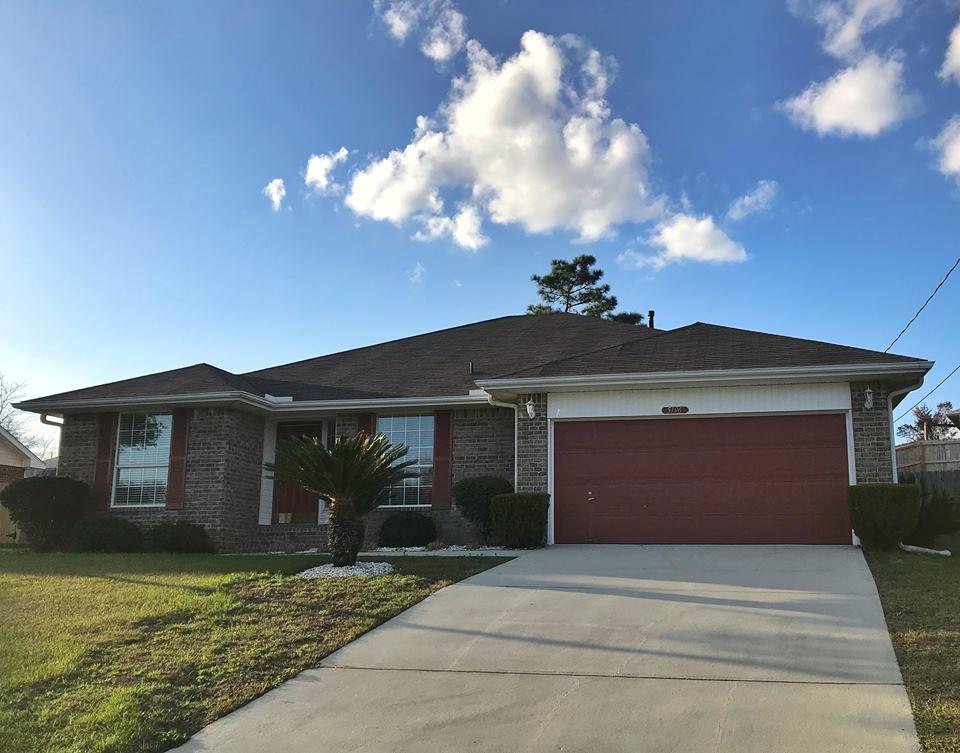 5196 Whitehurst Lane Crestview, FL 32536 - Photo 1 of 13 a front view of a house with yard