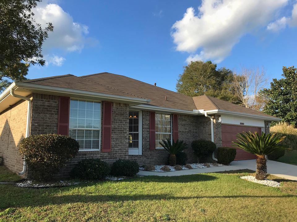 5196 Whitehurst Lane Crestview, FL 32536 - Photo 2 of 13 a front view of a house with garden