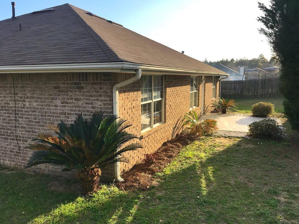 5196 Whitehurst Lane Crestview, FL 32536 - Photo 12 of 13 a front view of a house with garden
