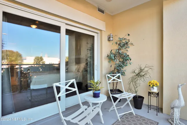 a kitchen with granite countertop a refrigerator stove and sink