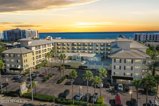 a view of a livingroom with furniture and a window