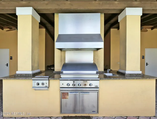 a view of a brick building with palm trees