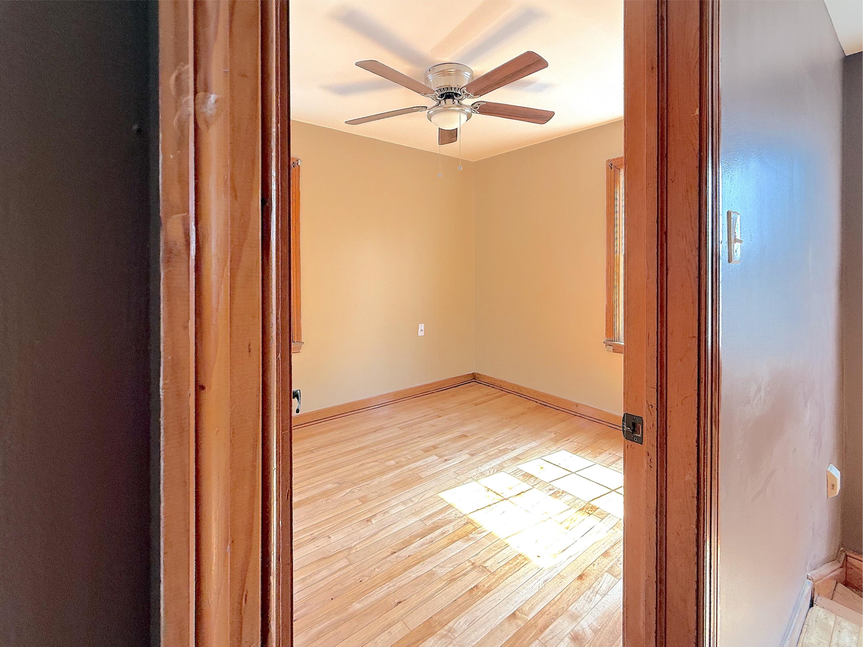 4039 Torrence Avenue Hammond, IN 46327 - Photo 27 of 34 a view of empty room with wooden floor and fan