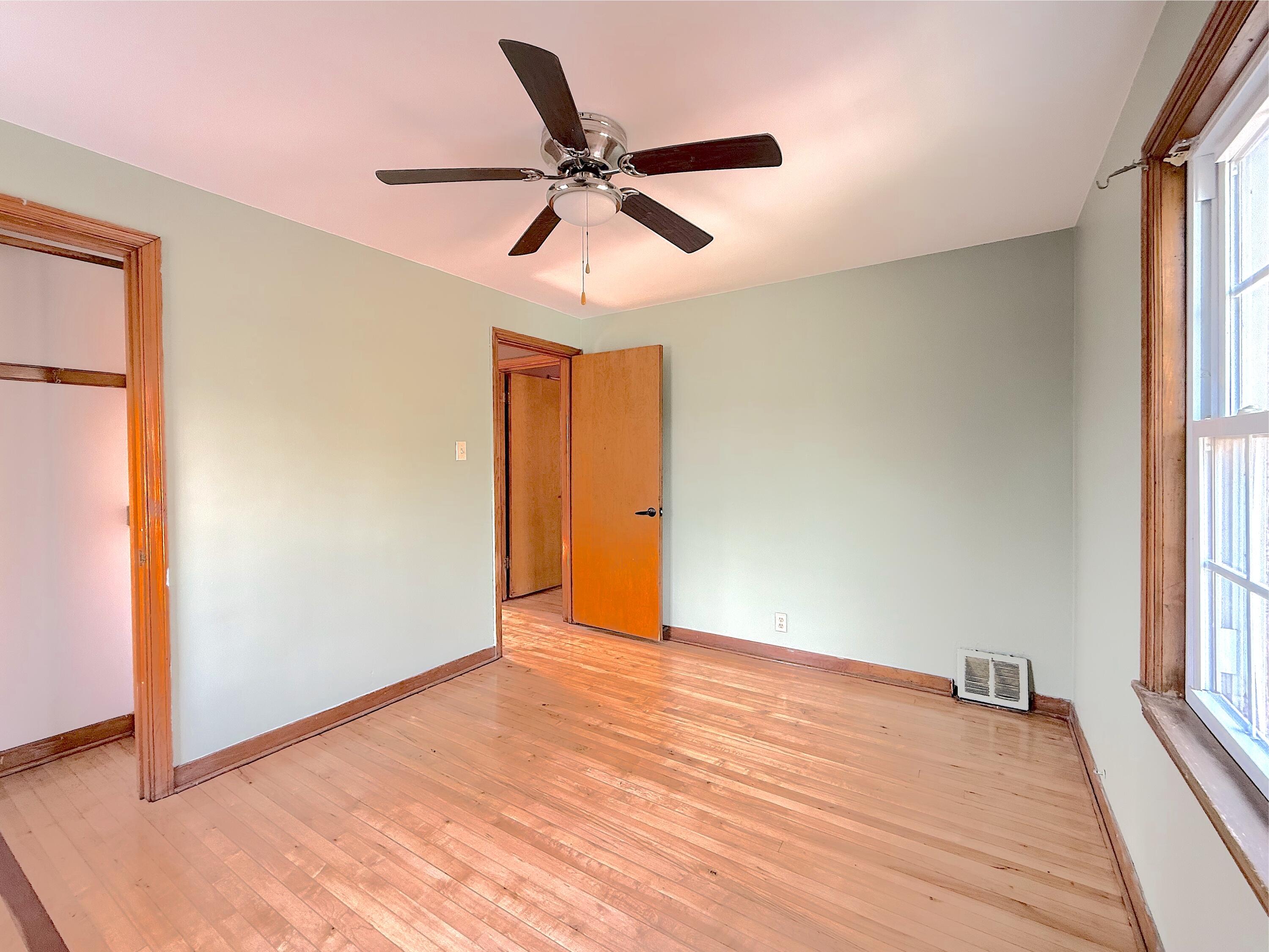 4039 Torrence Avenue Hammond, IN 46327 - Photo 32 of 34 wooden floor in an empty room with a window