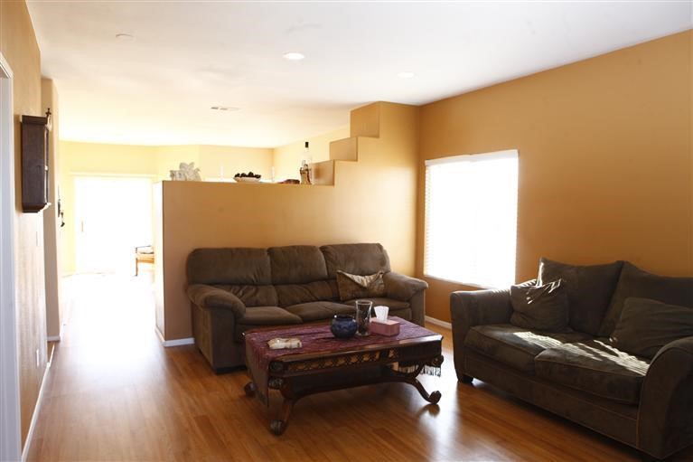 13565 Dos Palmas Road Victorville, CA 92392 - Photo 1 of 1 a living room with furniture and a wooden floor