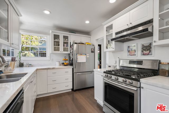 a kitchen with a stove a washer and dryer