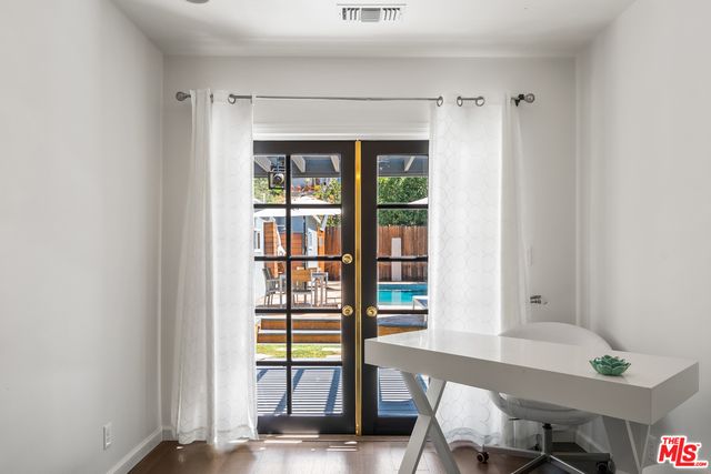 a living room with lots of furniture and a book shelf