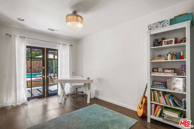 a bedroom with a bed and a couch