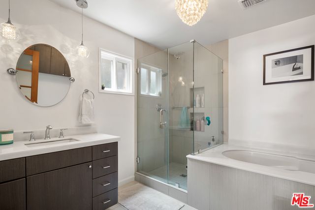 a bathroom with a sink and a shower