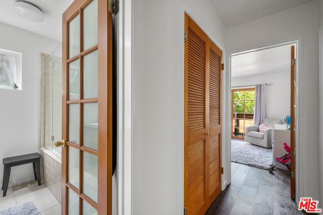 a bathroom with a bathtub sink and a mirror