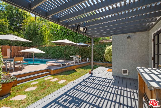 a view of a backyard with a patio