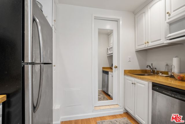 a spacious bathroom with a tub shower and sink