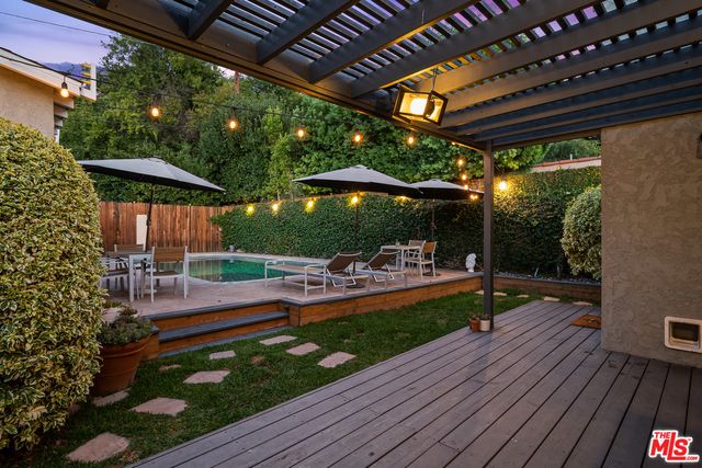 a view of outdoor space yard deck patio and outdoor kitchen